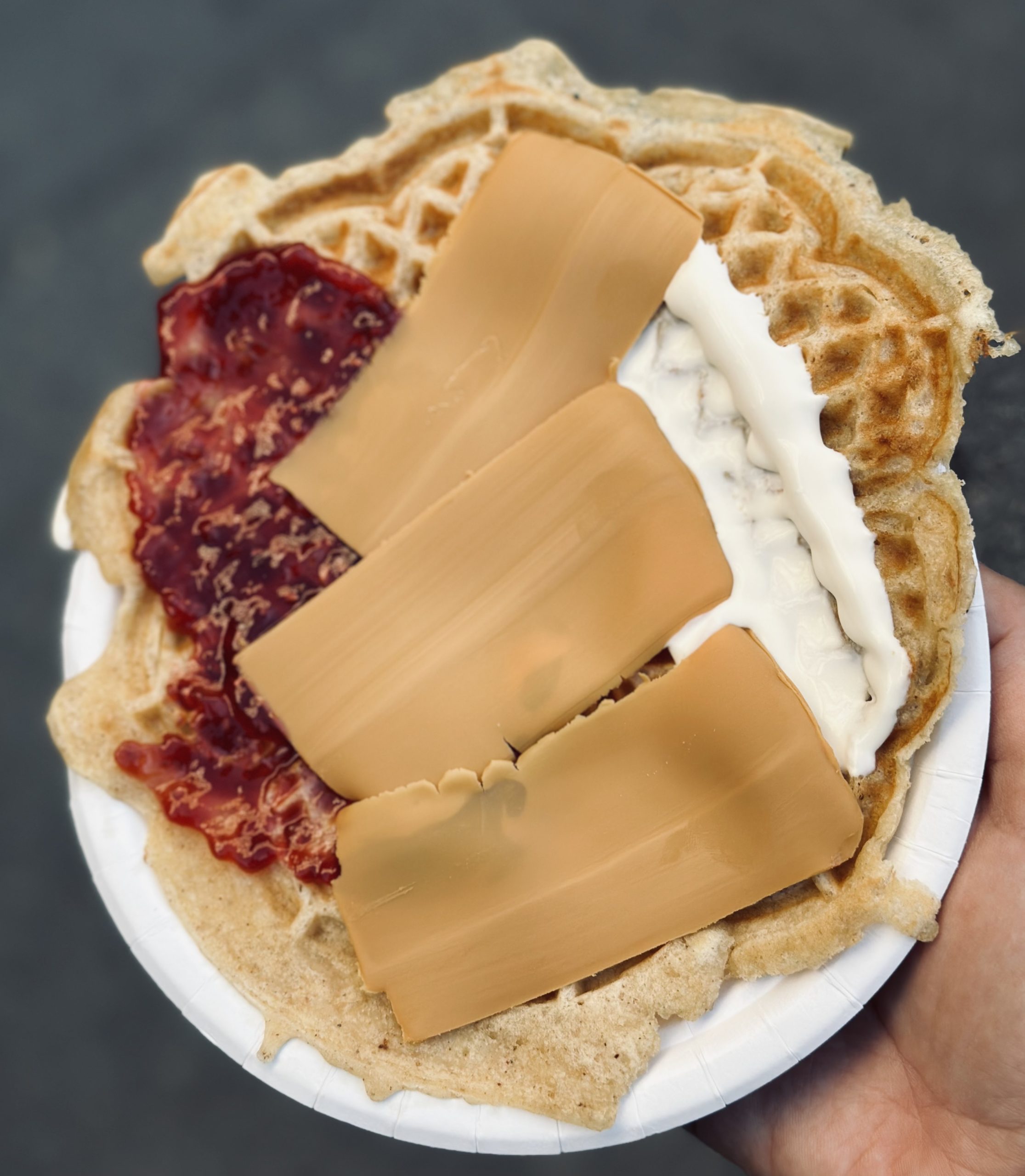 Norwegian Waffle with brown cheese, raspberry jam and sour cream making Oslo worth visiting